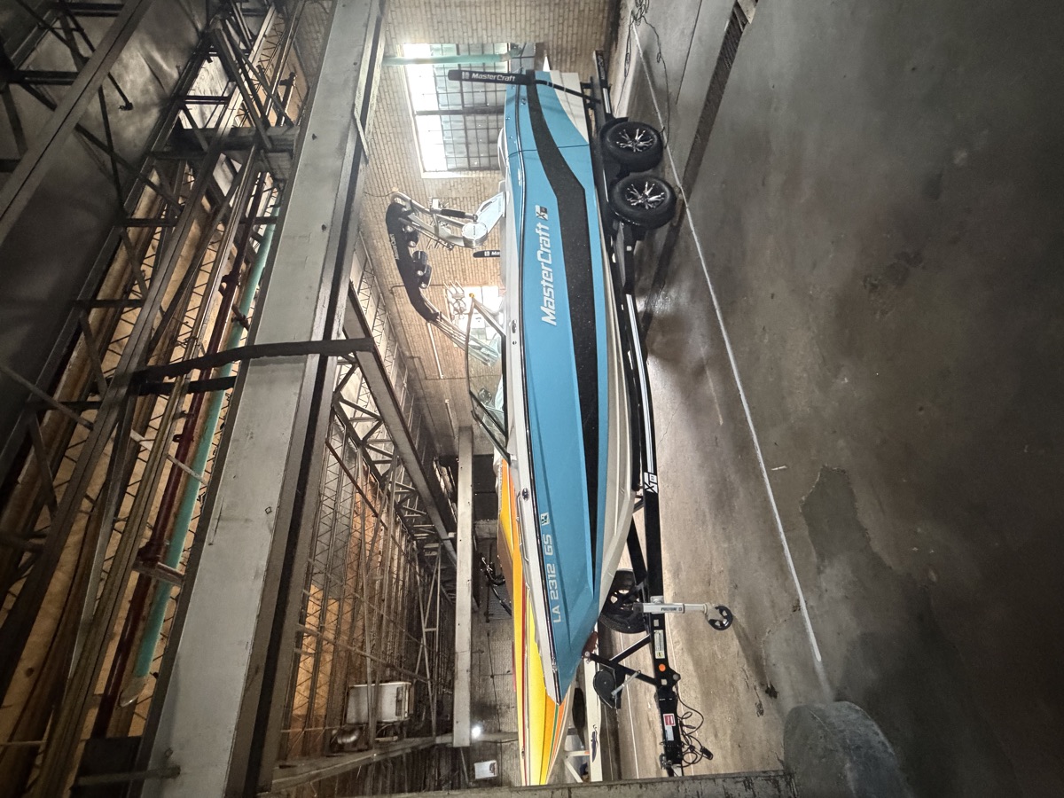 MasterCraft XT wake boat in its indoor stall