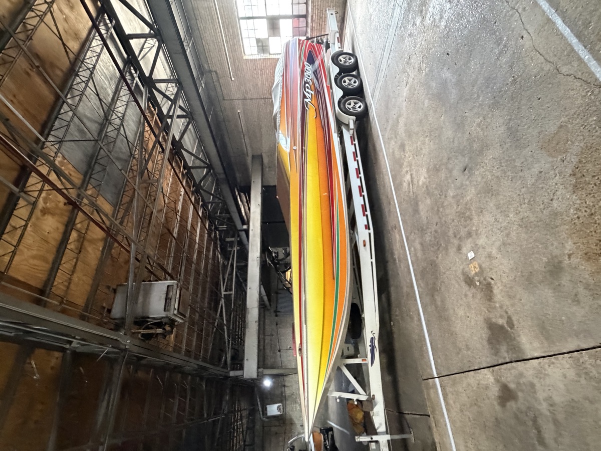 MP3000 offshore performance boat on a triple-axle trailer