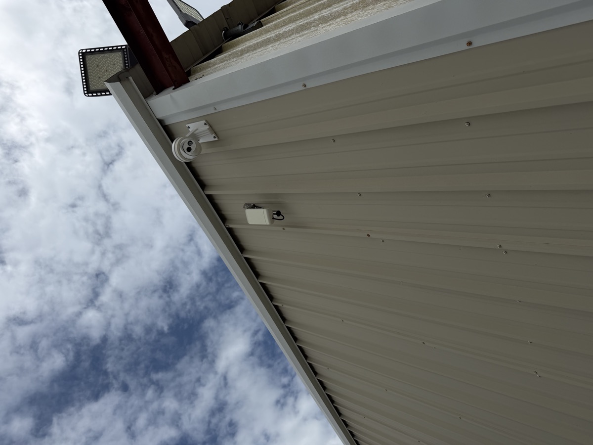 Security camera and floodlight on the corner of Building E